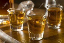 76272309-group-of-bourbon-whiskey-shots-ready-to-drink.jpg