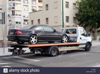 luxury-car-on-flatbed-tow-truck-spain-FJ422F.jpg