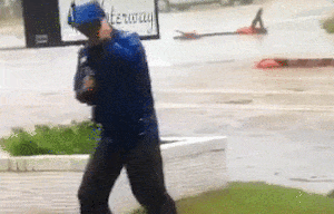 GIF-Weatherman-faking-high-winds.gif