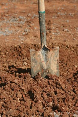 used-muddy-shovel-standing-pile-dirt-dirty-70561421.jpg