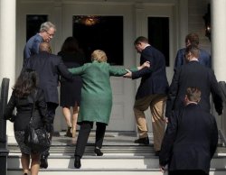 hillary-being-helped-up-stairs.jpg